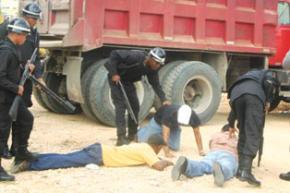 Student protesters are arrested outside the Ministry of Education for a demonstration over the milk scandal