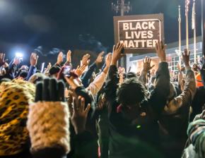 Protesters outside the Ferguson Police Department headquarters