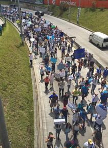 Guatemalan students arrive for solidarity demonstrations during a general strike