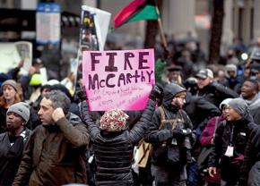 Thousands of Chicagoans march through the main shopping district on Black Friday