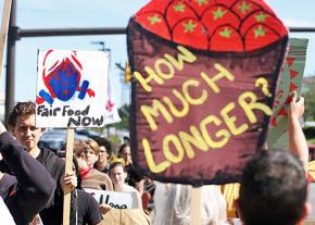 Supporters of the farmworkers' campaign march outside a Wendy's shareholders meeting