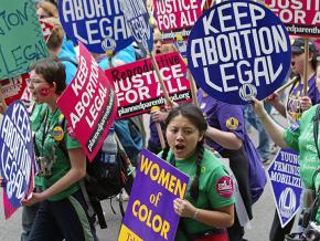 Activists march in defense of women's reproductive rights